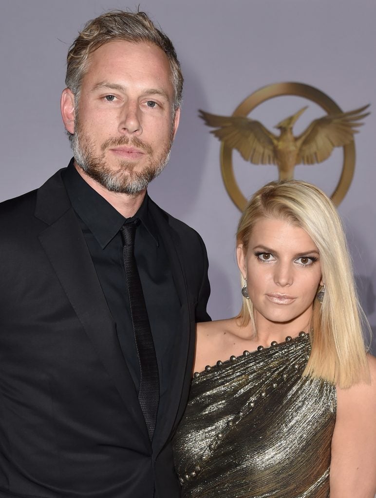 Eric Johnson (L) and singer/songwriter Jessica Simpson attend the premiere of Lionsgate's "The Hunger Games: Mockingjay - Part 1" at Nokia Theatre L.A. Live on November 17, 2014 in Los Angeles, California.  