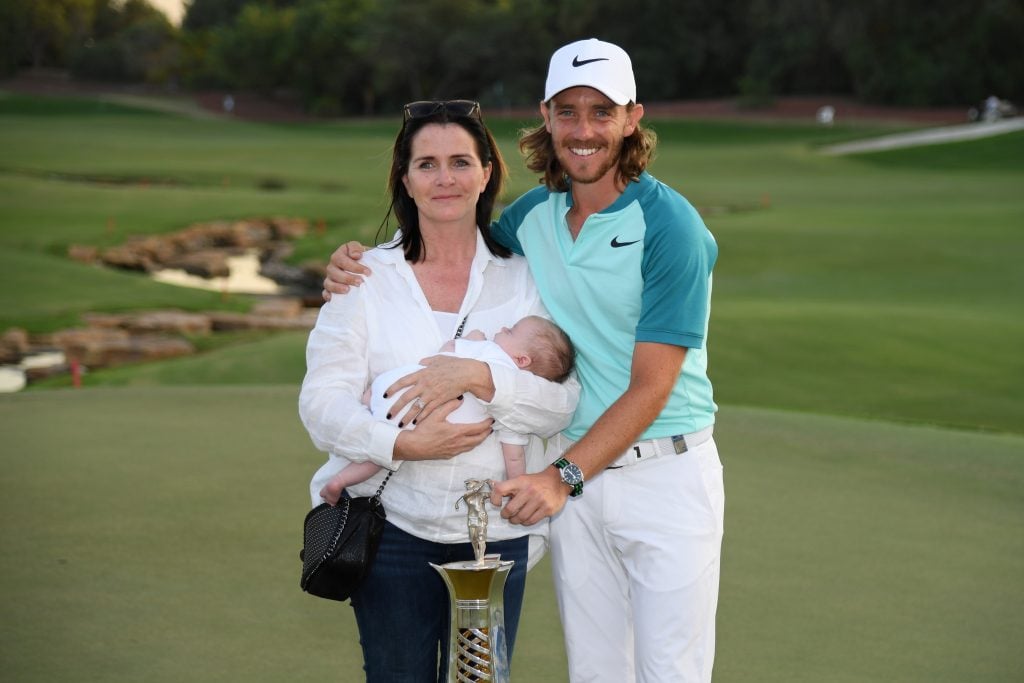 Tommy Fleetwood of England poses with the Race to Dubai trophy, partner Clare Craig and son Franklin during the final round of the DP World Tour Championship at Jumeirah Golf Estates on November 19, 2017 in Dubai, United Arab Emirates.