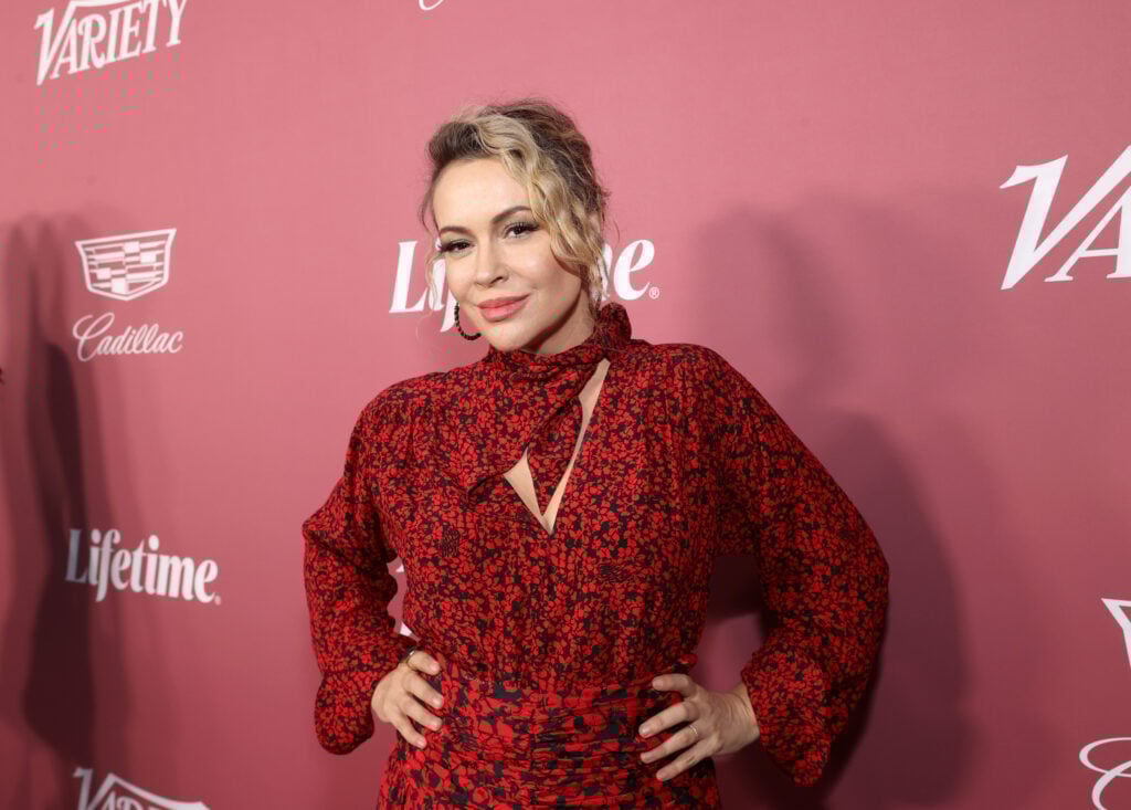 Alyssa Milano wears red.