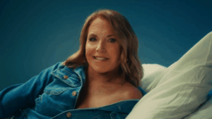 Katie Couric in an open denim jacket.