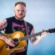 Zach Bryan performs during the Quittin Time tour at Nissan Stadium on June 29, 2024 in Nashville, Tennessee.