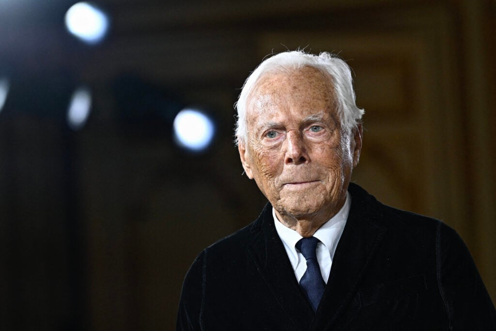 Italian designer Giorgio Armani acknowledges the applause at the end of his presentation for Armani Prive during the Women's Haute-Couture Spring/Summer 2025 Fashion Week to mark its 20th anniversary, in Paris on January 28, 2025.