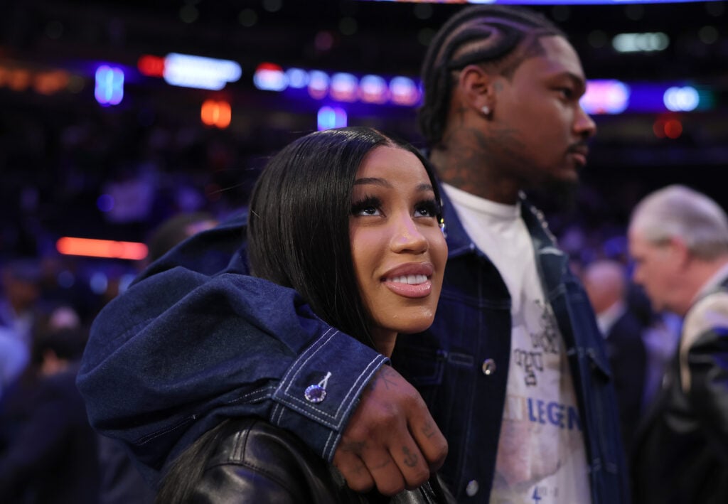 NFL Player Stefon Diggs (R) and rapper Cardi B (L) celebrate after Game Four of the Eastern Conference Second Round NBA Playoffs between the Boston Celtics and the New York Knicks at Madison Square Garden on May 12, 2025 in New York City.