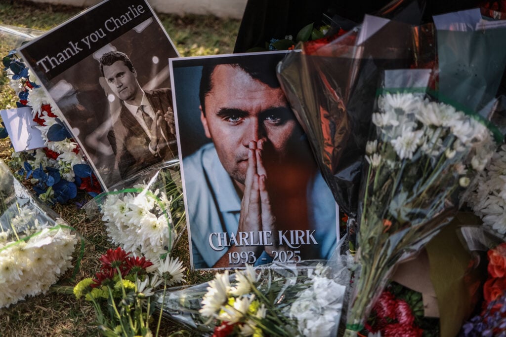 A general view of a wreath laid by mourners outside the US Embassy in Pretoria on September 11, 2025 following the fatal shooting of US youth activist and influencer Charlie Kirk while speaking during an event at Utah Valley University in Orem, Utah, United States.