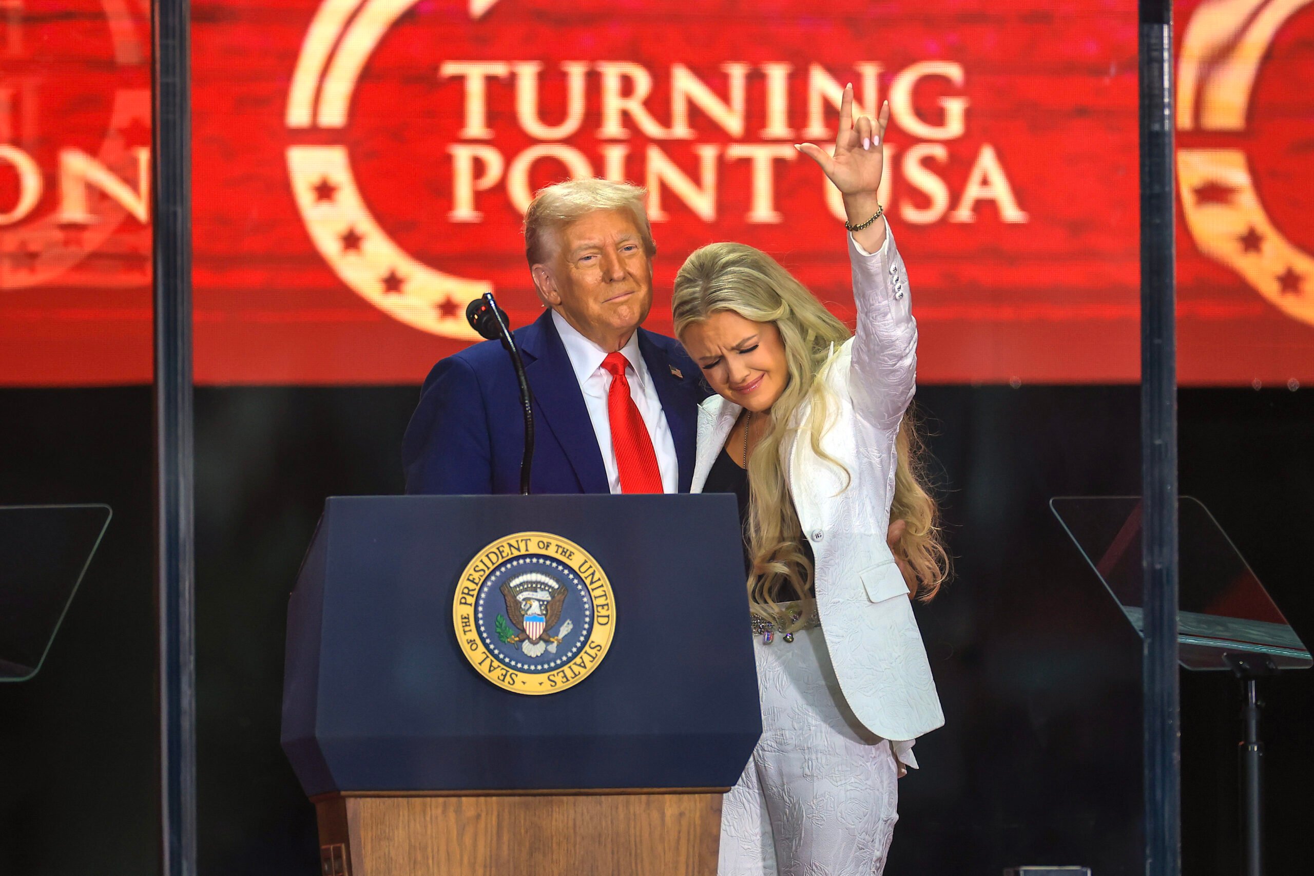 Mrs. Erika Kirk joins U.S. President Donald Trump onstage during the memorial service for political activist Charlie Kirk at State Farm Stadium on September 21, 2025 in Glendale, Arizona. 
