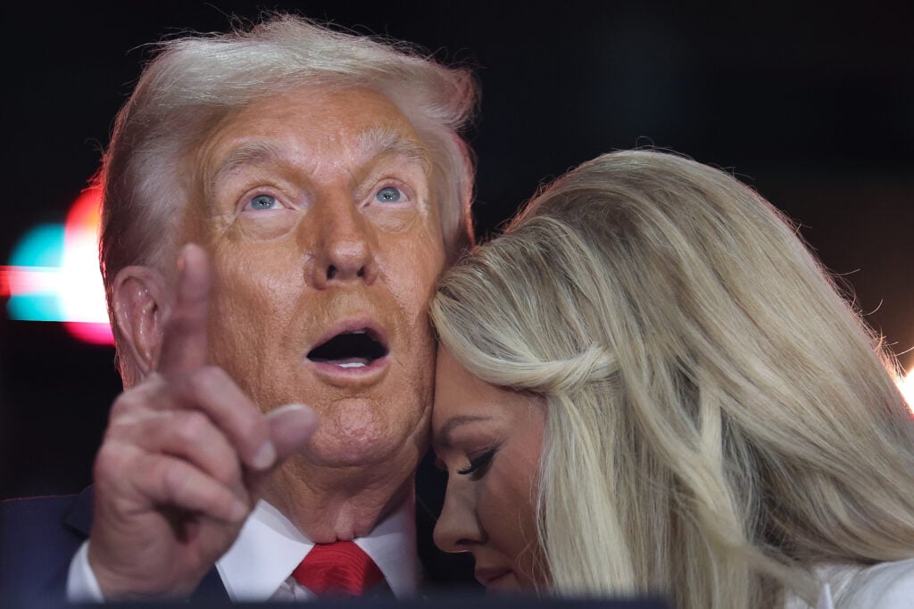 Erika Kirk joins U.S. President Donald Trump onstage during the memorial service for political activist Charlie Kirk at State Farm Stadium on September 21, 2025 in Glendale, Arizona. 