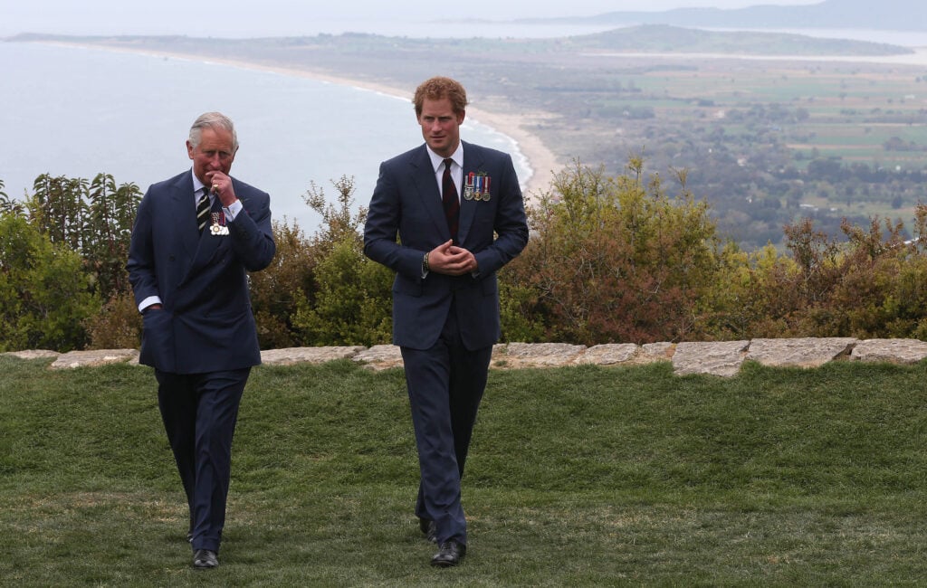 Prince Harry chats with Prince Charles, Prince of Wales during a visit to The Nek, a narrow stretch of ridge in the Anzac battlefield on the Gallipoli Peninsula, as part of commemorations marking the 100th anniversary of the Battle of Gallipoli on April 25, 2015 in Gallipoli,Turkey.