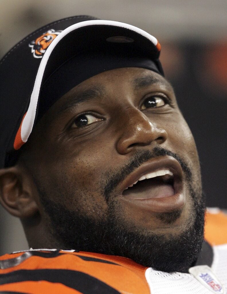 Rudi Johnson  #32 of the Cincinnati Bengals smiles on the sidelines during the NFL pre-season game against the Indianapolis Colts on September 1, 2006 at the RCA Dome in Indianapolis, Indiana.  