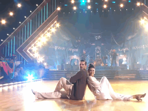 Hilaria Baldwin sitting on the DWTS stage.
