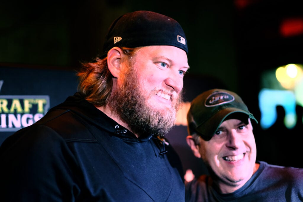 Football center Nick Mangold poses for a photo with fans as he attends DraftKings Kickoff Bash 2018 at Pilsener Haus & Biergarten on September 9, 2018 in Hoboken City.