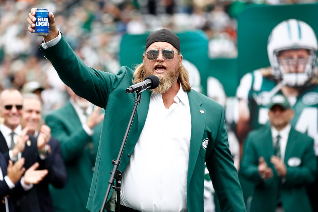 Former New York Jets player Nick Mangold speaks as he is inducted into the Jets Ring of Honor during halftime of the game against the Cincinnati Bengals at MetLife Stadium on September 25, 2022 in East Rutherford, New Jersey.