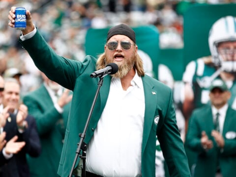 Former New York Jets player Nick Mangold speaks as he is inducted into the Jets Ring of Honor during halftime of the game against the Cincinnati Bengals at MetLife Stadium on September 25, 2022 in East Rutherford, New Jersey.