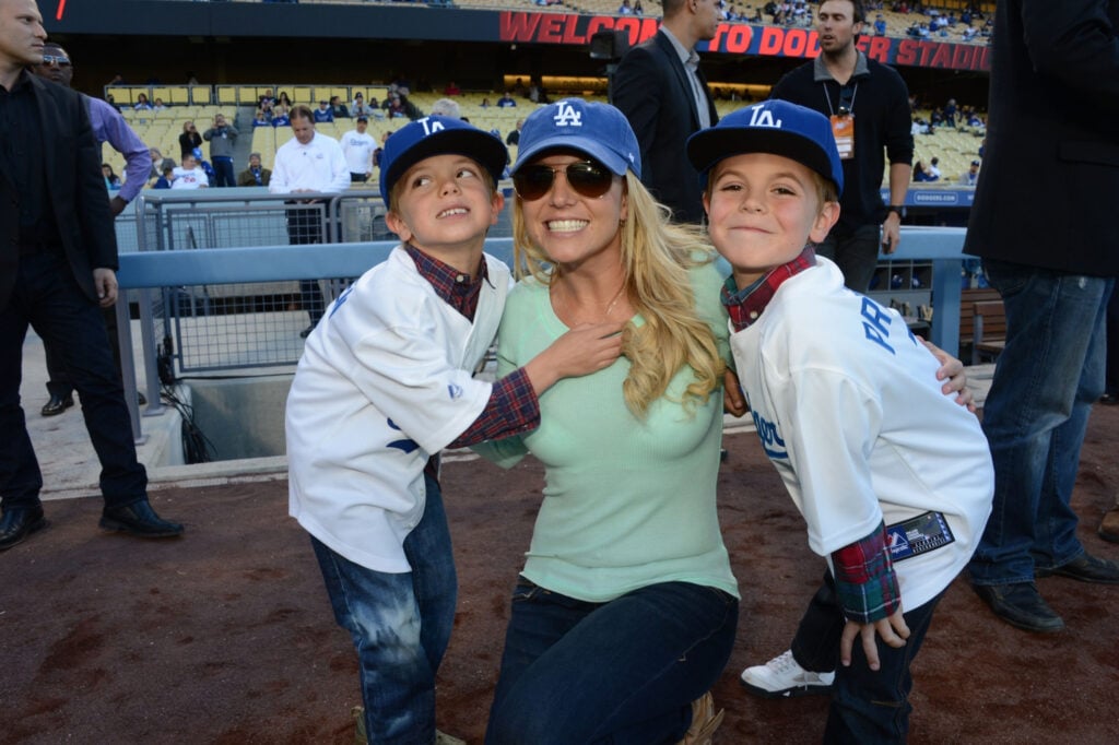 Britney Spears poses with sons Jayden James Federline (L) and Sean Preston Federline (R) during a game against the San Diego Padres at Dodger Stadium on April 17, 2013 in Los Angeles, California. 