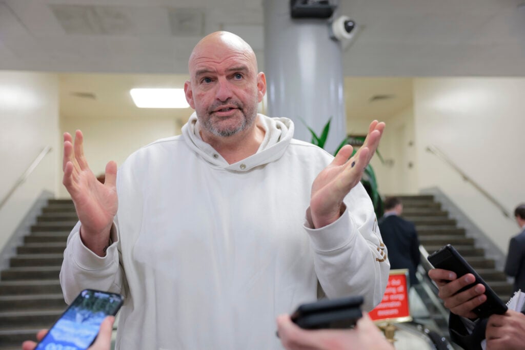 U.S. Sen. John Fetterman (D-PA) speaks to reporters in the Senate Subway during a series of confirmation votes for U.S. President Donald Trump's cabinet nominees at the U.S. Capitol Building on February 12, 2025 in Washington, DC.