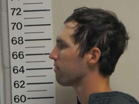 In this handout image provided by the Office of the Governor of Utah, Tyler Robinson stands for a booking photo on September 12, 2025 in Spanish Fork, Utah.