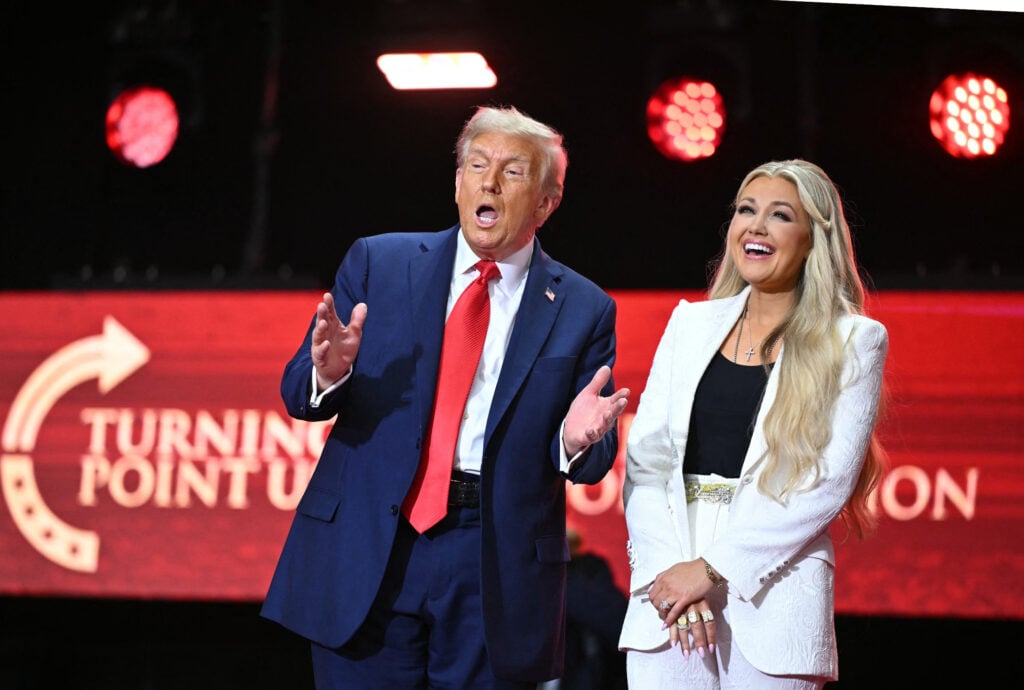 US President Donald Trump reacts next to Erika Kirk, widow of Charlie Kirk, after speaking at the public memorial service for right-wing activist Charlie Kirk at State Farm Stadium in Glendale, Arizona, on September 21, 2025. 
