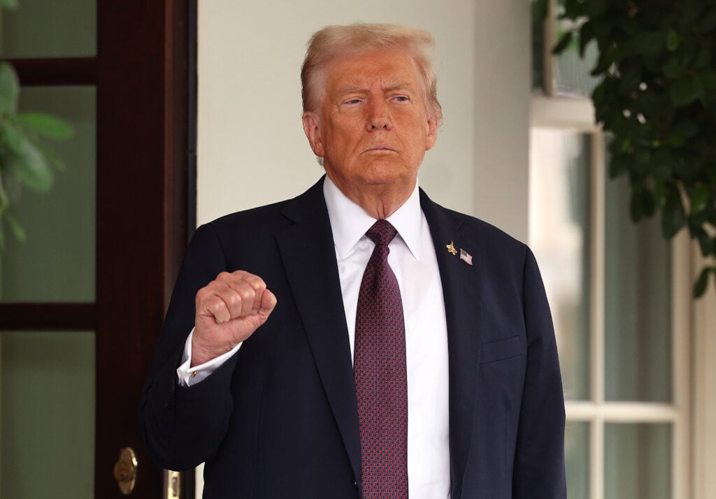 U.S. President Donald Trump pumps his first as he waits to welcome Israeli Prime Minister Benjamin Netanyahu at the White House on September 29, 2025 in Washington, DC.