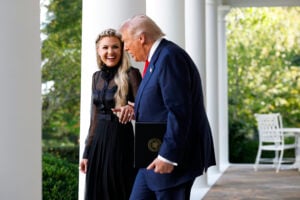 Erika Kirk, wife of late conservative activist Charlie Kirk, arrives with U.S. President Donald Trump as he posthumously awards the Presidential Medal of Freedom to Charlie Kirk during a ceremony in the Rose Garden of the White House on October 14, 2025 in Washington, DC.