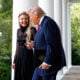 Erika Kirk, wife of late conservative activist Charlie Kirk, arrives with U.S. President Donald Trump as he posthumously awards the Presidential Medal of Freedom to Charlie Kirk during a ceremony in the Rose Garden of the White House on October 14, 2025 in Washington, DC.