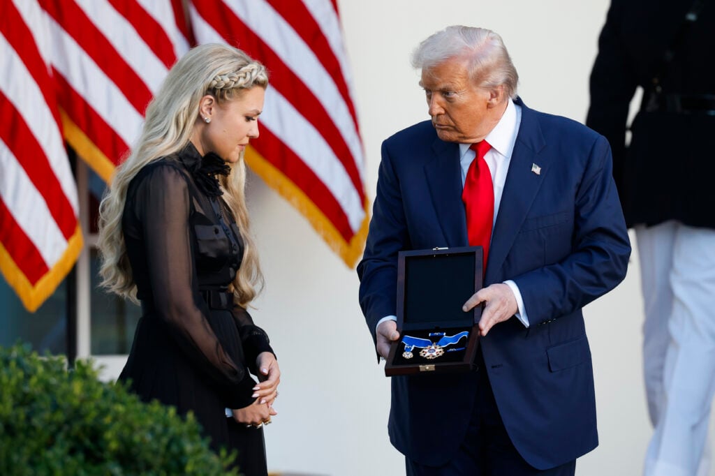 U.S. President Donald Trump posthumously awards the Presidential Medal of Freedom to late conservative activist Charlie Kirk as he presents the Medal to his wife Erika Kirk (L) during a ceremony in the Rose Garden of the White House on October 14, 2025 in Washington, DC. 