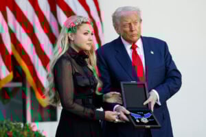 U.S. President Donald Trump posthumously awards the Presidential Medal of Freedom to late conservative activist Charlie Kirk as he presents the Medal to his wife Erika Kirk (L) during a ceremony in the Rose Garden of the White House on October 14, 2025 in Washington, DC.