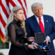 U.S. President Donald Trump posthumously awards the Presidential Medal of Freedom to late conservative activist Charlie Kirk as he presents the Medal to his wife Erika Kirk (L) during a ceremony in the Rose Garden of the White House on October 14, 2025 in Washington, DC.