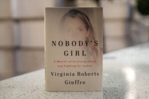 A copy of the book "Nobody's Girl - A Memoir of Surviving Abuse and Fighting for Justice" by Virginia Roberts Giuffre, is pictured in central London on October 21, 2025, on the day of its release in the UK.