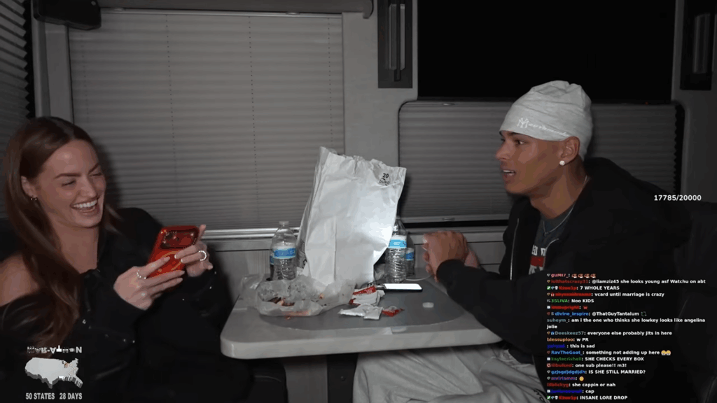 Haley Kalil types on her phone while seated across from Marlon Garcia.