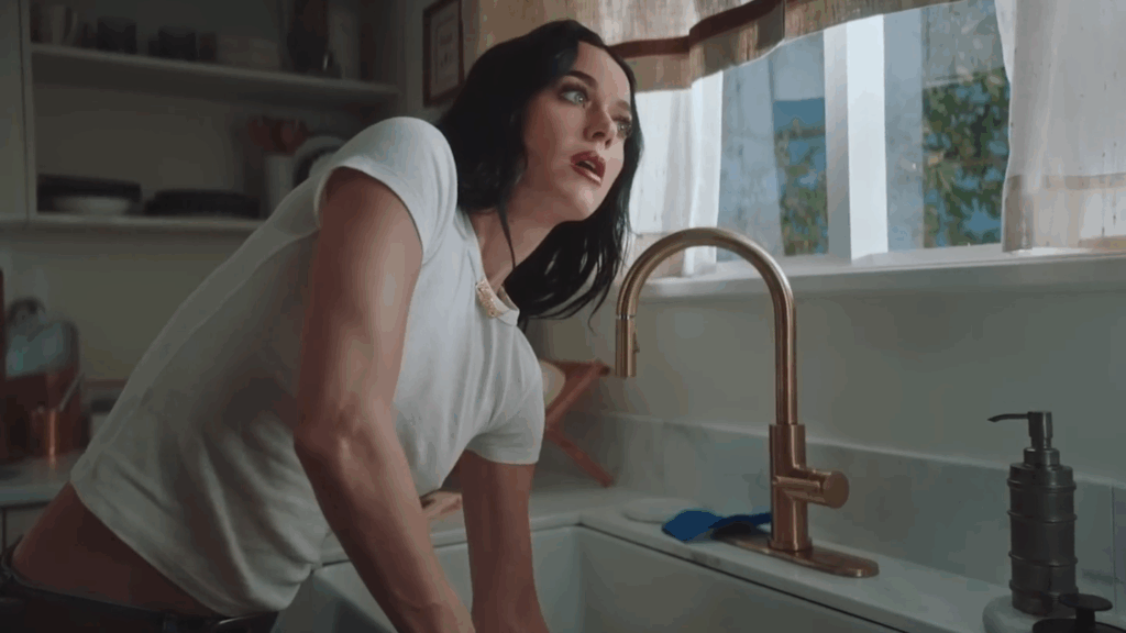 Katy Perry tries to get a ring out of the sink in her "Bandaids" music video.