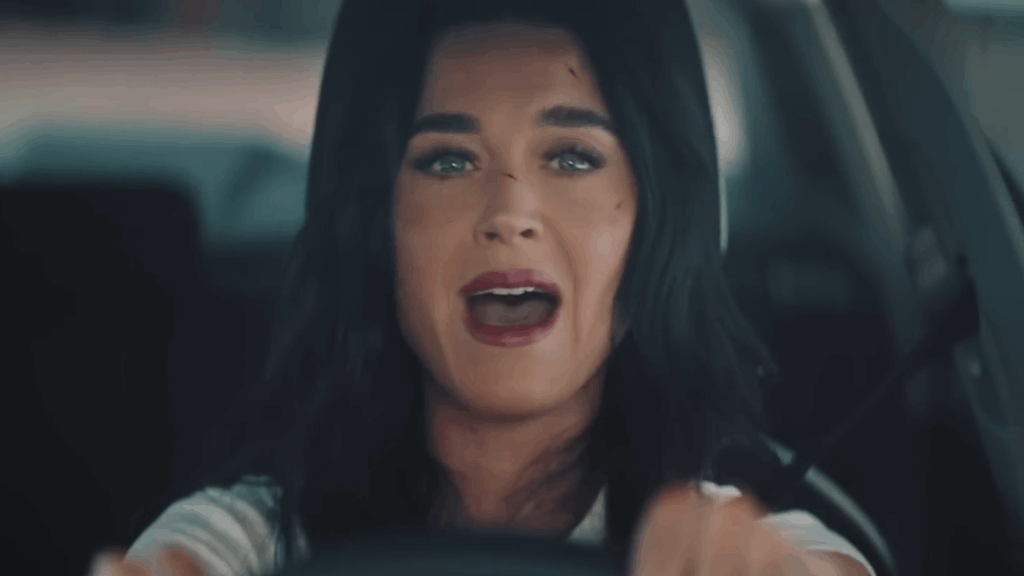 Katy Perry sings while driving in the "Bandaids" music video.
