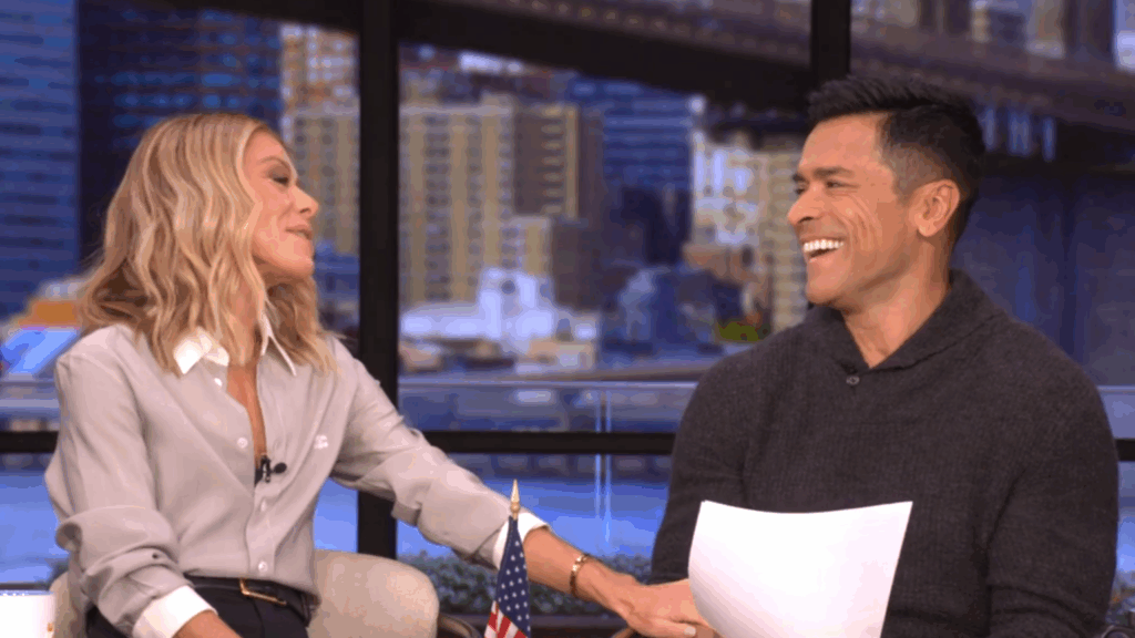 Kelly Ripa and Mark Consuelos laugh together.