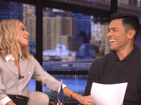 Kelly Ripa and Mark Consuelos laugh together.