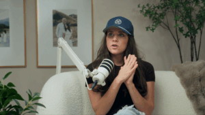 Jinger Duggar wears a hat on her podcast.