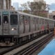 Passengers wait to board an "L" train at a station on November 09, 2021 in Chicago, Illinois.