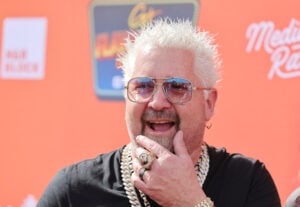 Guy Fieri is interviewed at Guy Fieri's Flavortown Tailgate on February 12, 2023 in Glendale, Arizona.