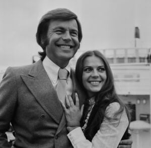 Actor Robert Wagner smiling with his wife Natalie Wood, Heathrow Airport, London, April 24th 1972.
