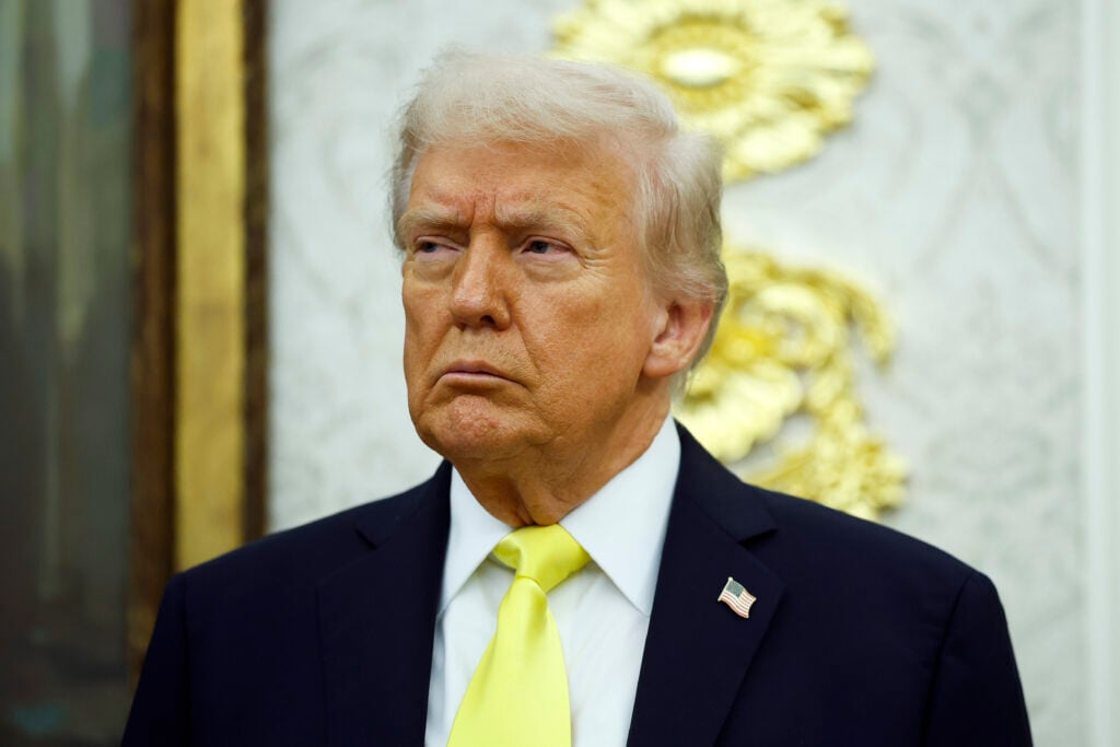 U.S. President Donald Trump looks on during a press conference in the Oval Office of the White House on October 15, 2025 in Washington, DC. Trump and Federal Bureau of Investigation Director Kash Patel provided an update on the Trump administration’s progress in reducing violent crime.