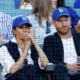 Prince Harry, Duke of Sussex and Meghan, Duchess of Sussex look on from the stands during game four of the 2025 World Series between the Toronto Blue Jays and the Los Angeles Dodgers at Dodger Stadium on October 28, 2025 in Los Angeles, California.