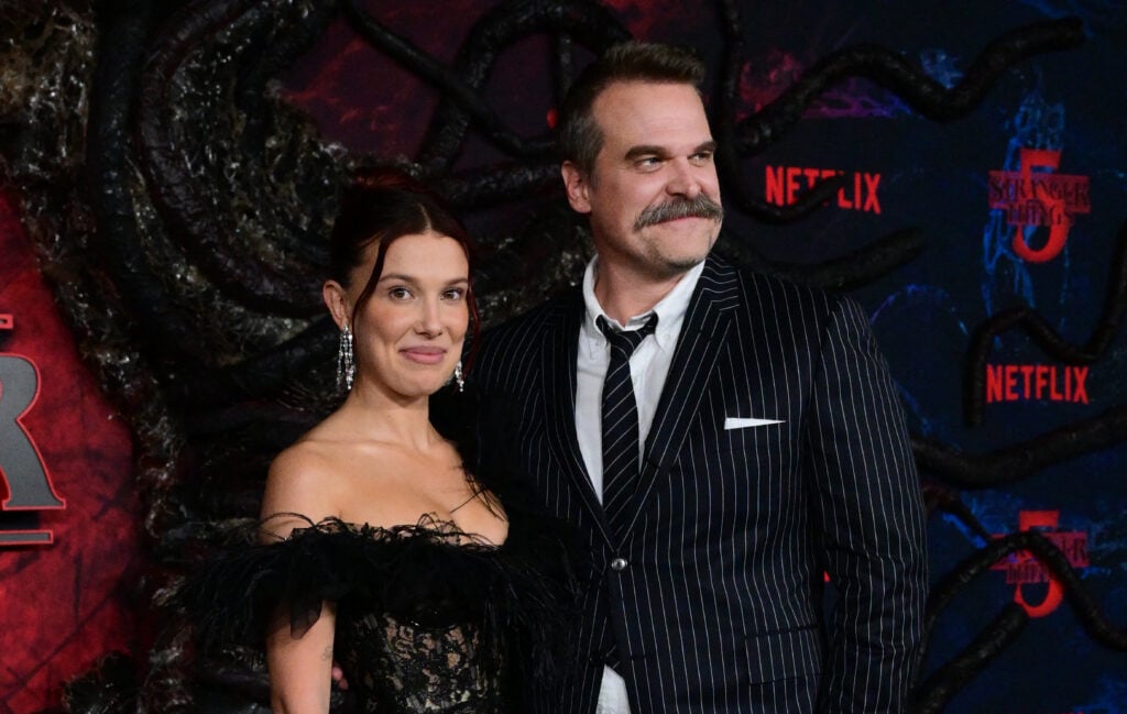 British actress Millie Bobby Brown and US actor David Harbour attend the world premiere of Netflix's "Stranger Things", Season 5, at the TCL Chinese theatre in Los Angeles on November 6, 2025.