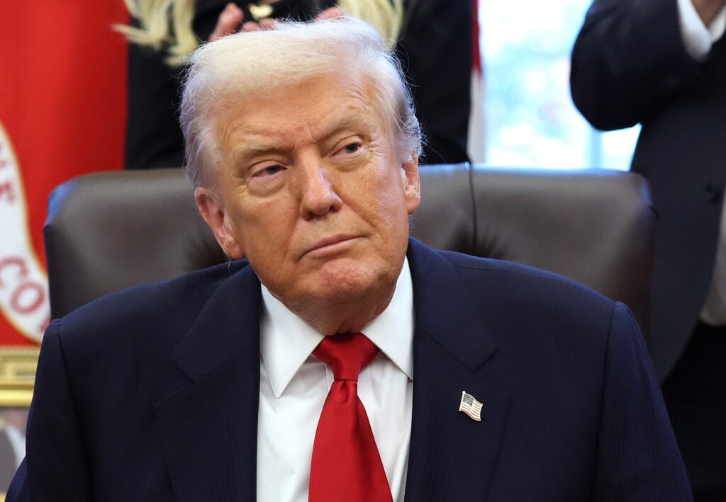 U.S. President Donald Trump looks on during the swearing-in ceremony of U.S. Ambassador to India Sergio Gor in the Oval Office of the White House on November 10, 2025 in Washington, DC.