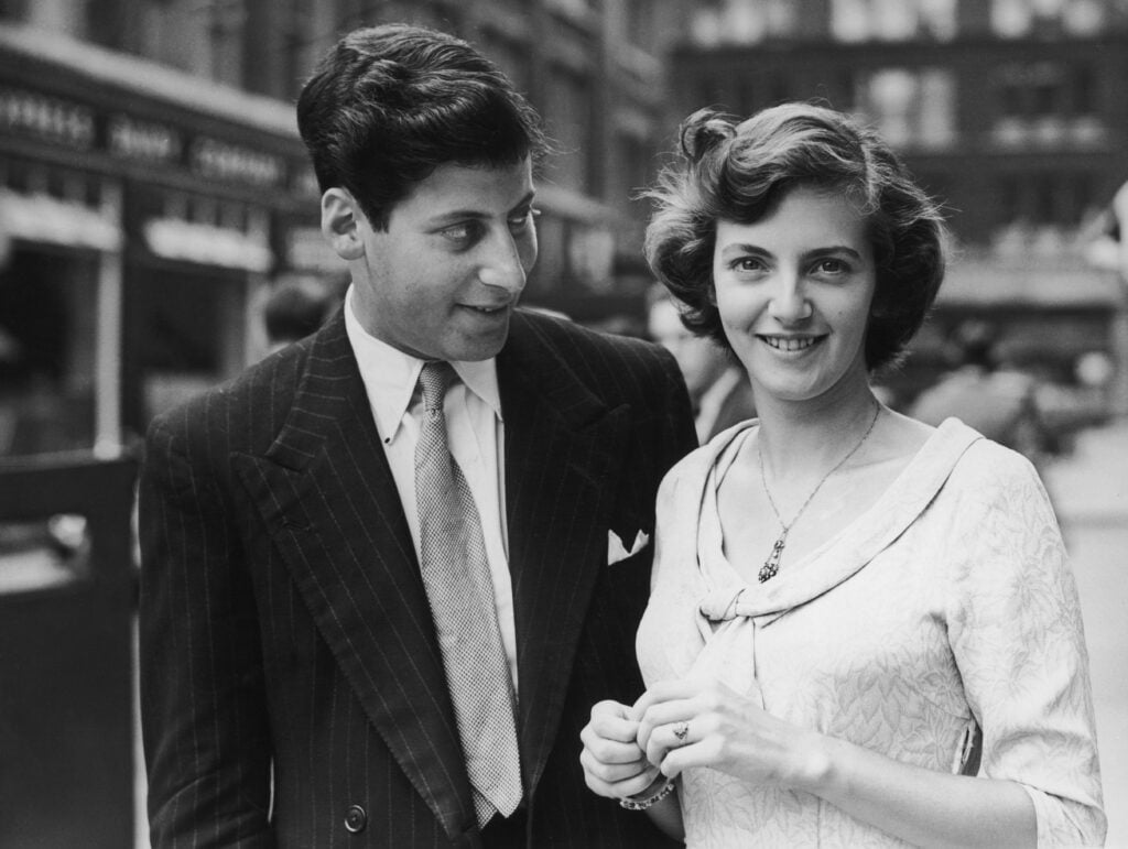English broadcaster, writer, politician and chef Clement Freud (1924 - 2009) in London with his fiancee, actress June Flewett, shortly after their engagement was announced, 28th June 1950. 