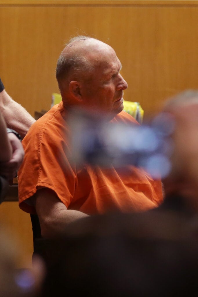 Joseph James DeAngelo is taken on a wheel chair into the courtroom to be arraigned on two counts of murder April 27, 2018, in Sacramento, California. - Investigators have accused him of of being the 'Golden State Killer,' who is suspected of committing more than 50 rapes and 12 murders.