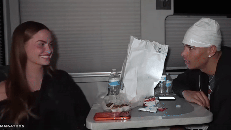 Haley Kalil lets her arm drop to astonish Marlon Garcia.