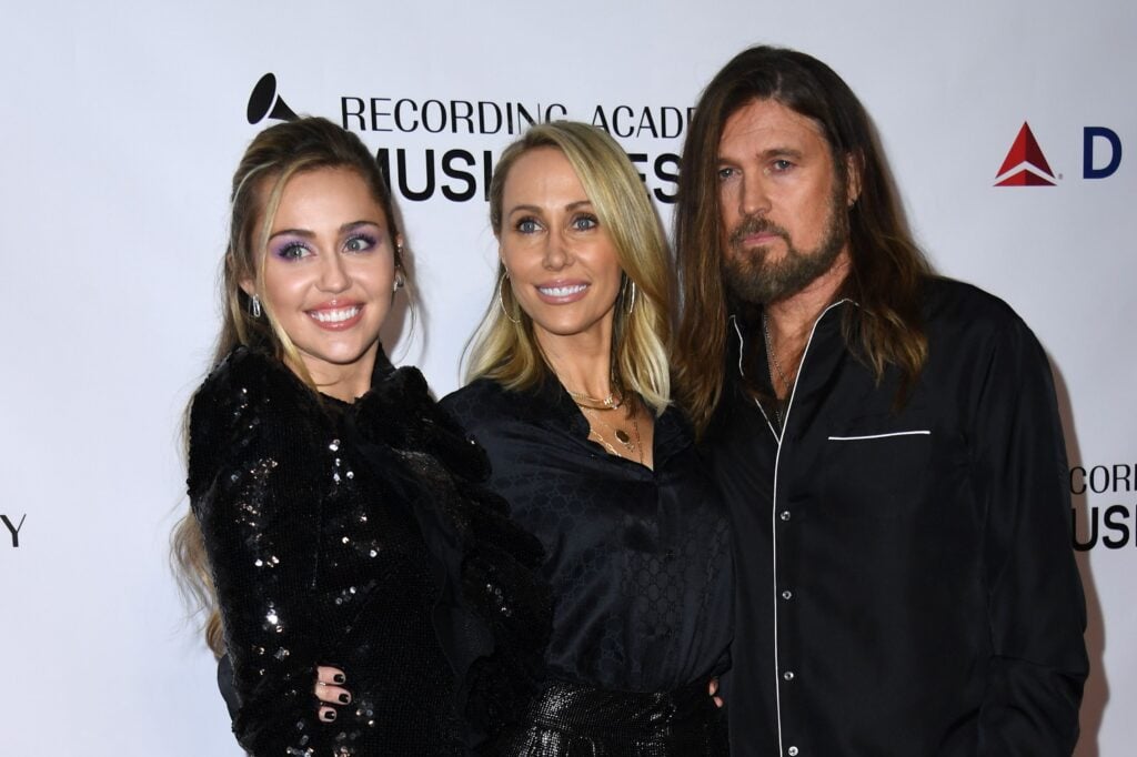 Miley Cyrus with parents Tish Cyrus and Billy Ray Cyrus.