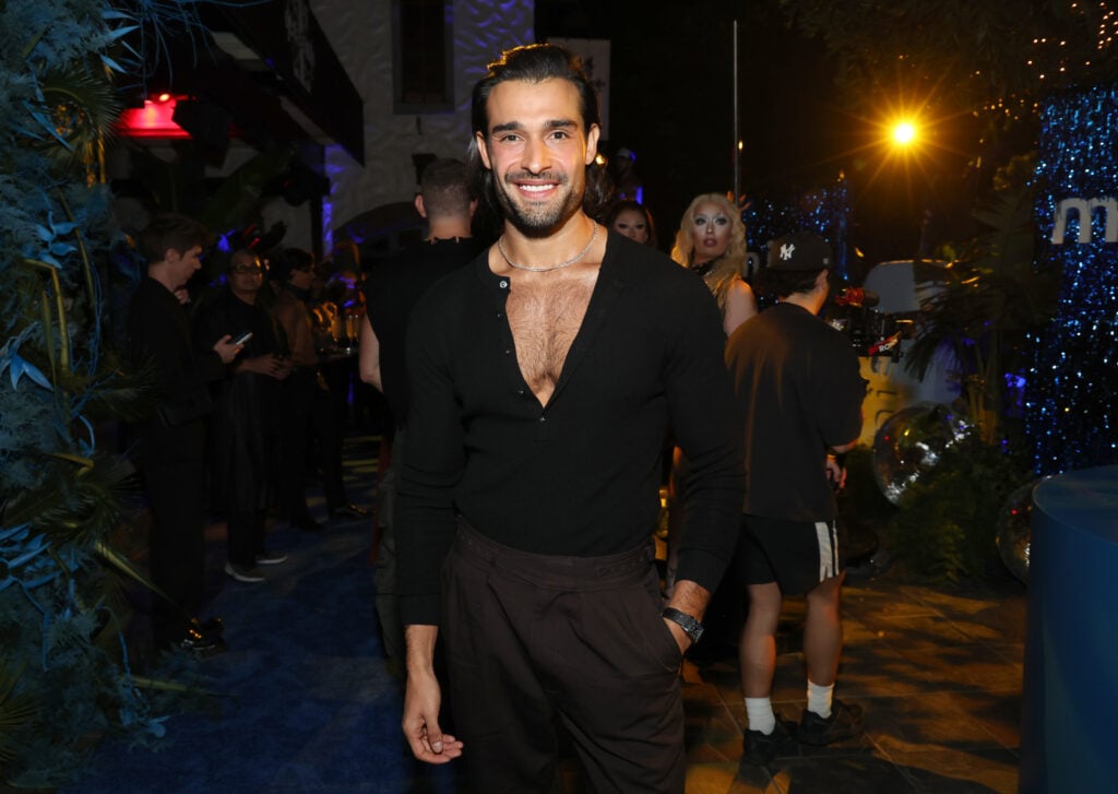 Sam Asghari in a plunging neckline in October 2025.