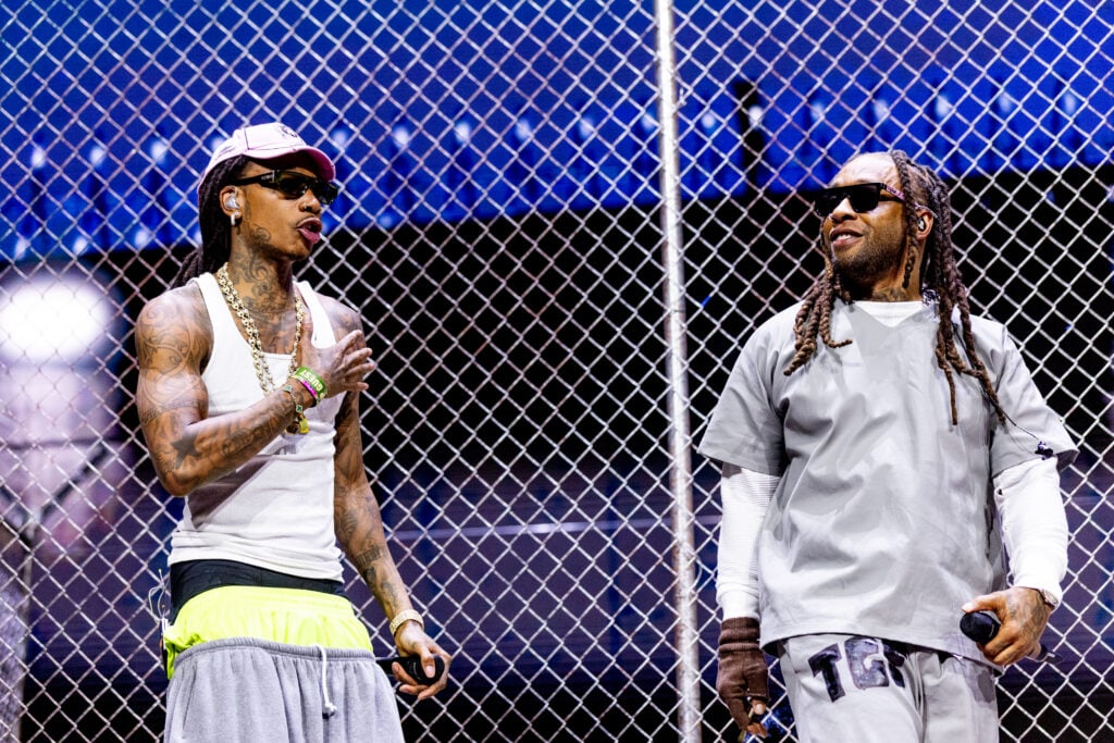 Wiz Khalifa and hsi arms at 2025 Coachella.