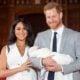 Britain's Prince Harry, Duke of Sussex (R), and his wife Meghan, Duchess of Sussex, pose for a photo with their newborn baby son, Archie Harrison Mountbatten-Windsor, in St George's Hall at Windsor Castle in Windsor, west of London on May 8, 2019.