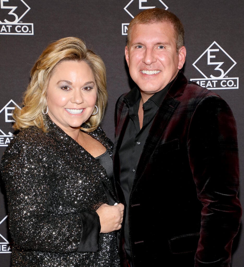 Julie Chrisley (L) and Todd Chrisley attend the grand opening of E3 Chophouse Nashville on November 20, 2019 in Nashville, Tennessee. 