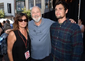 Rob Reiner (center) and wife Michele Singer (L) and son Nick Reiner (R) attend Teen Vogue's Back-to-School Saturday kick-off event at The Grove on August 9, 2013 in Los Angeles, California.