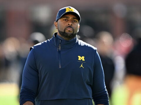 Acting head coach Sherrone Moore of the Michigan Wolverines watches the teams warm up before the game against the Maryland Terrapins at SECU Stadium on November 18, 2023 in College Park, Maryland.